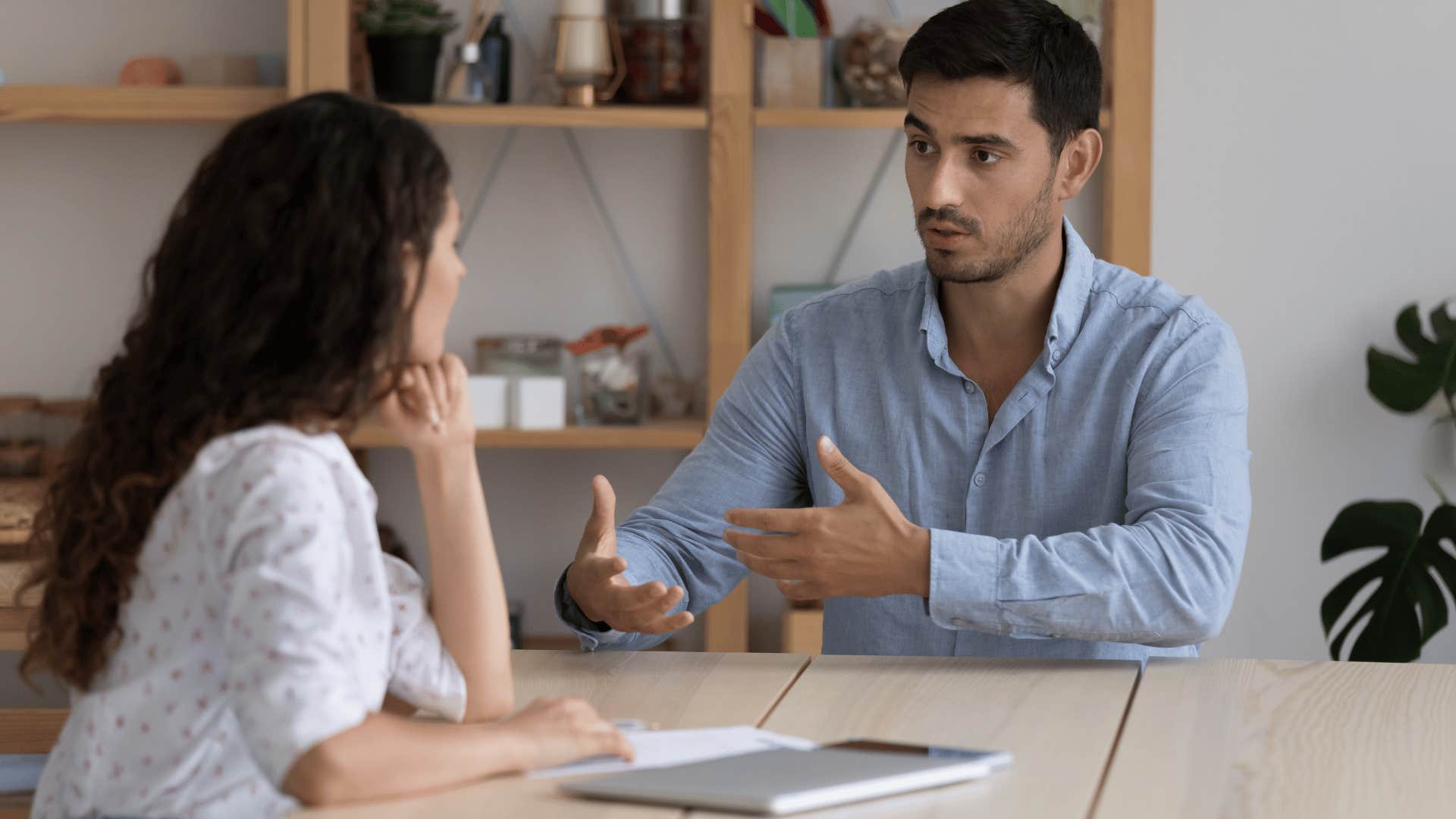 professional man explaining something to woman