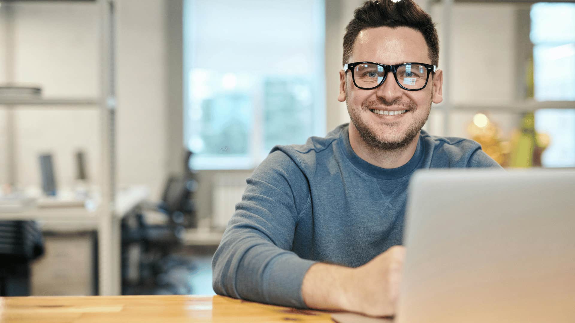 smiling man working in an office