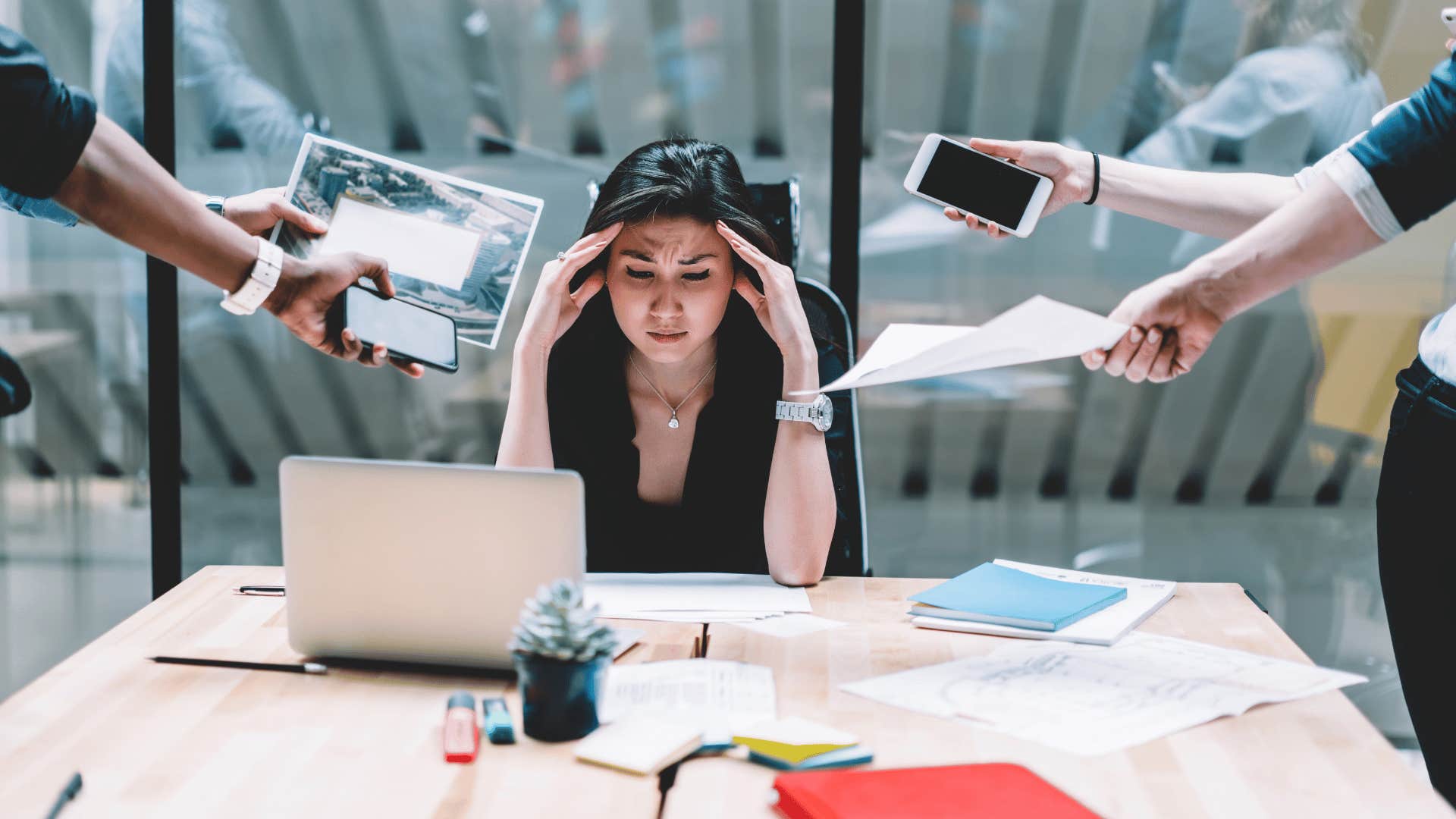 stressed professional woman avoiding multiple tasks