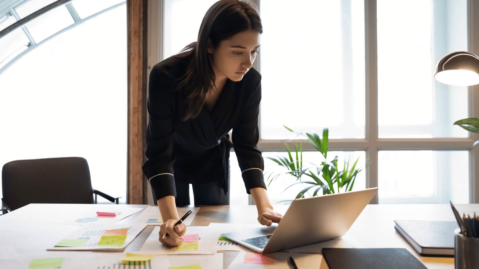 young professional woman working alone