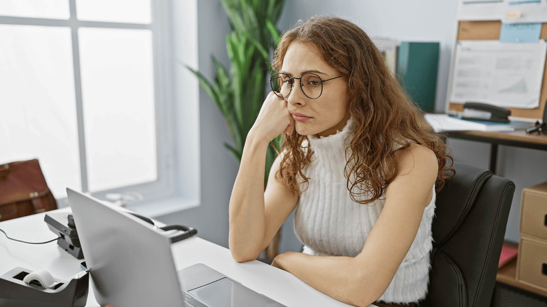 bored young woman in an office