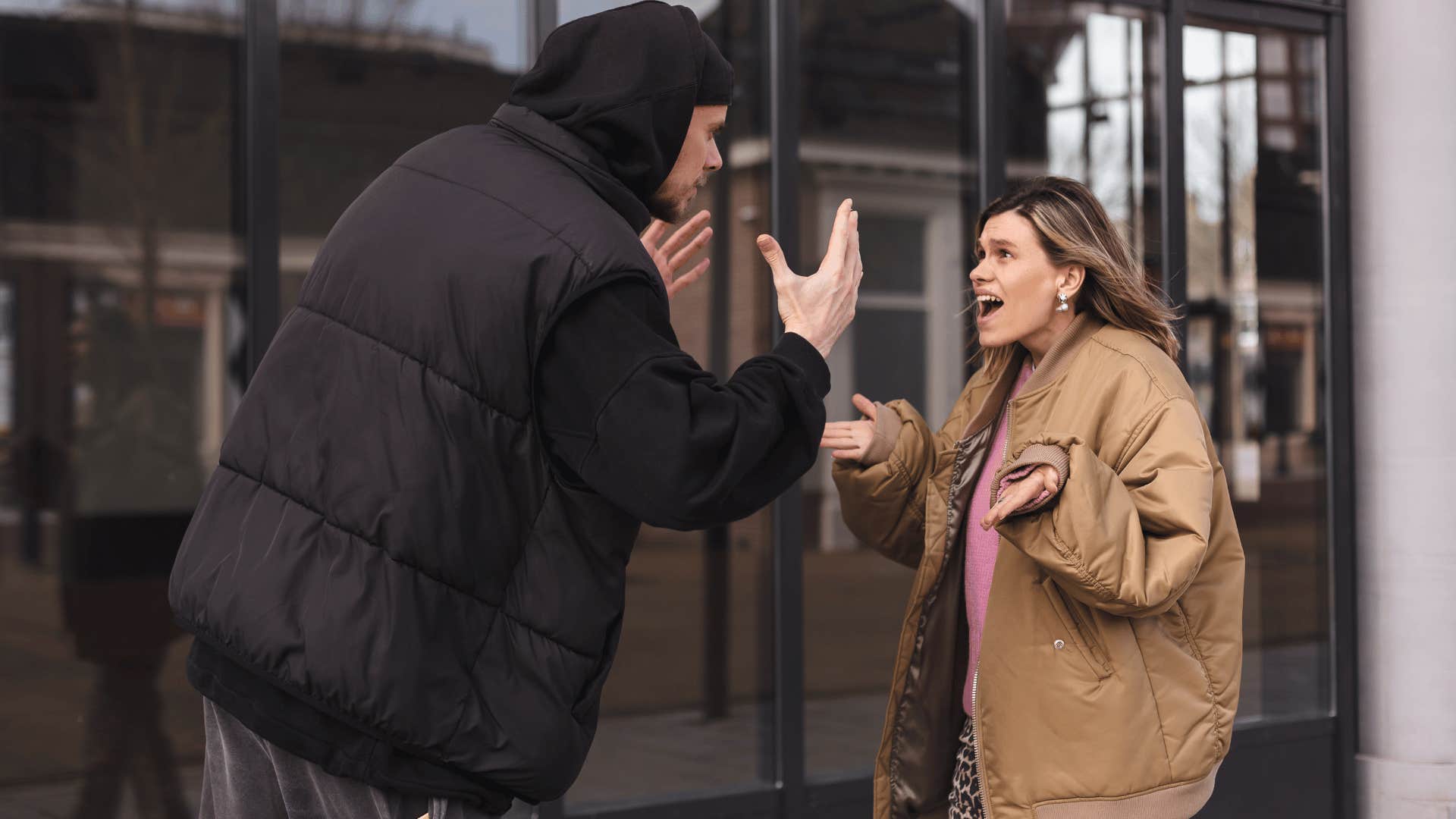 man overreacting and yelling at a young woman