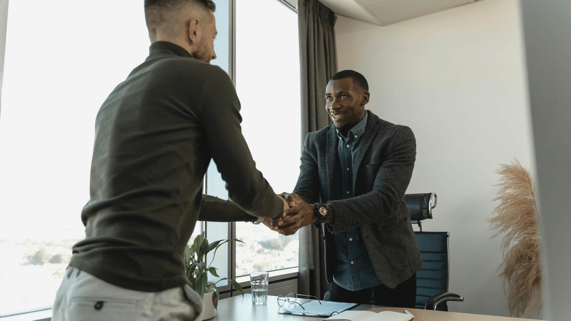 two professional men shaking hands