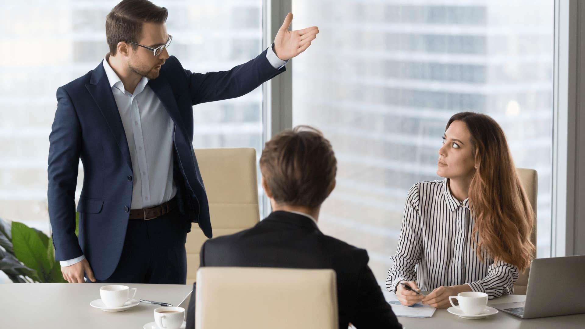 upset man in an office meeting