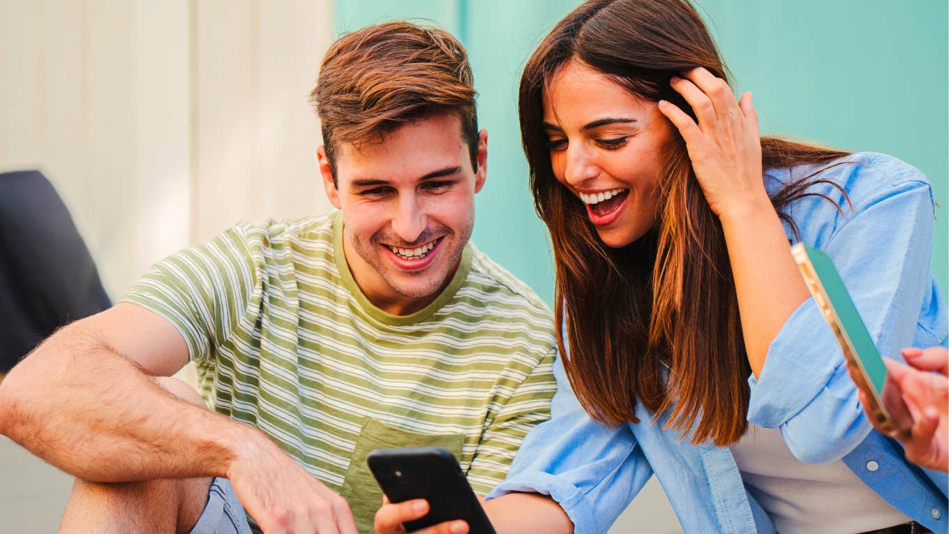 couple looking at their phones to see if they can hear the silent gif