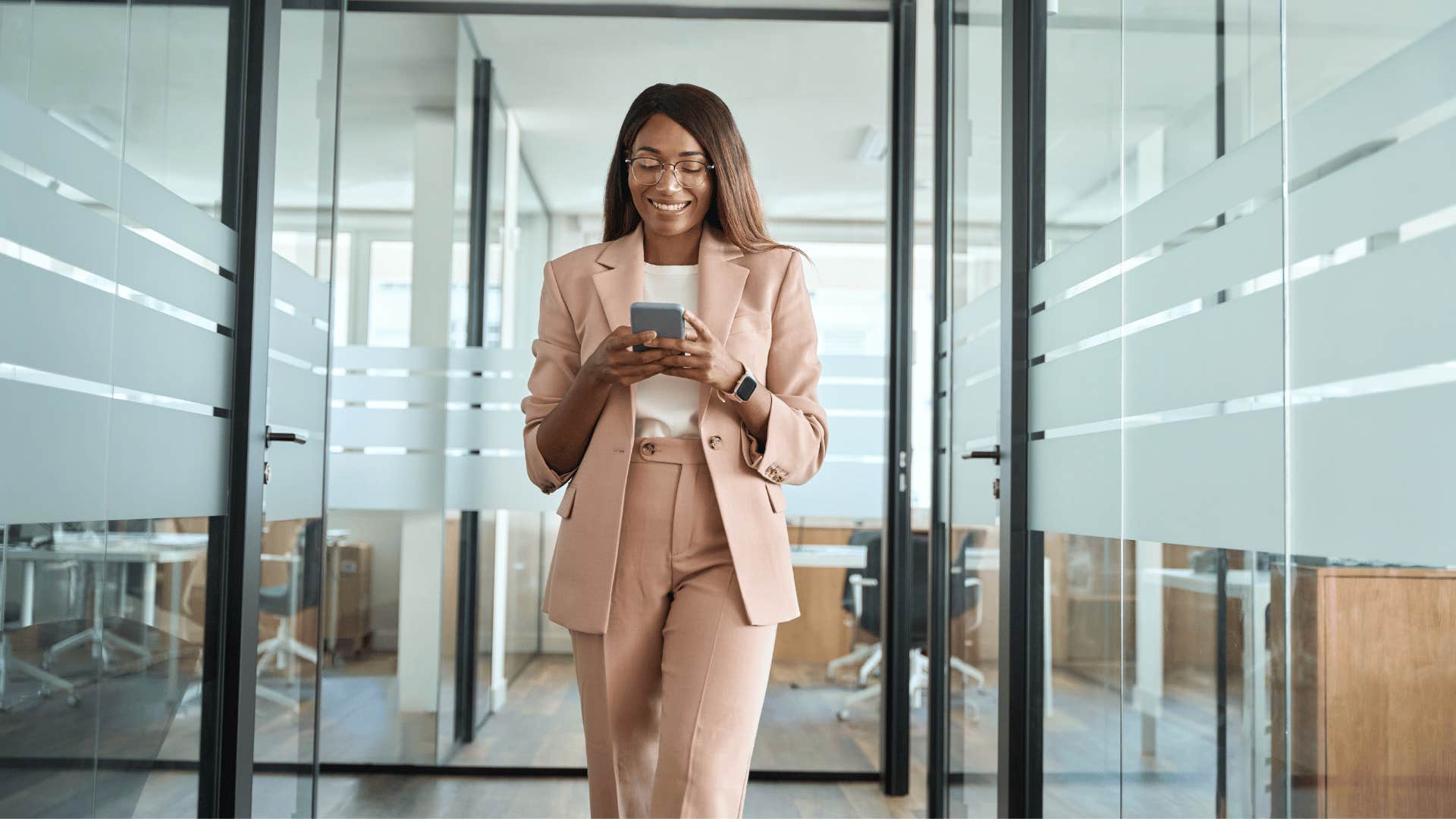 smiling business woman on her phone