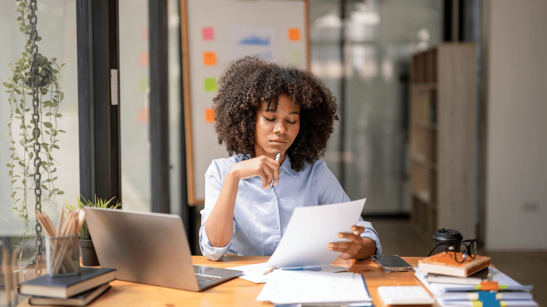 young professional woman looking with attention to detail