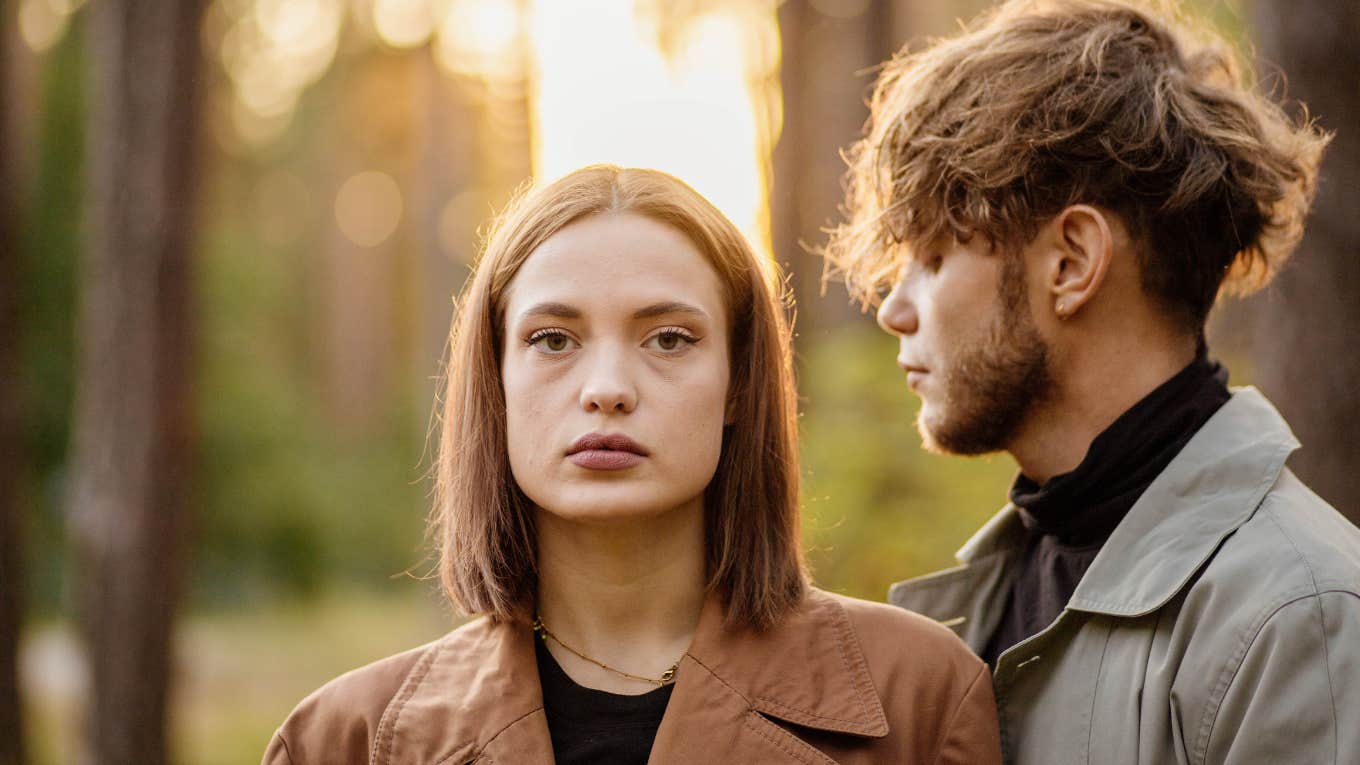 Redhead woman trying to break free from guy who treated her bad