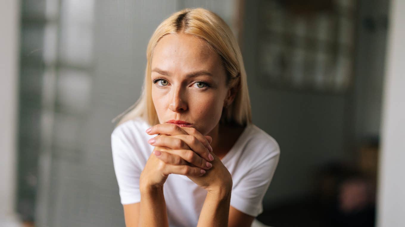 Woman looking serious, experiencing effects of relationship with narcissist