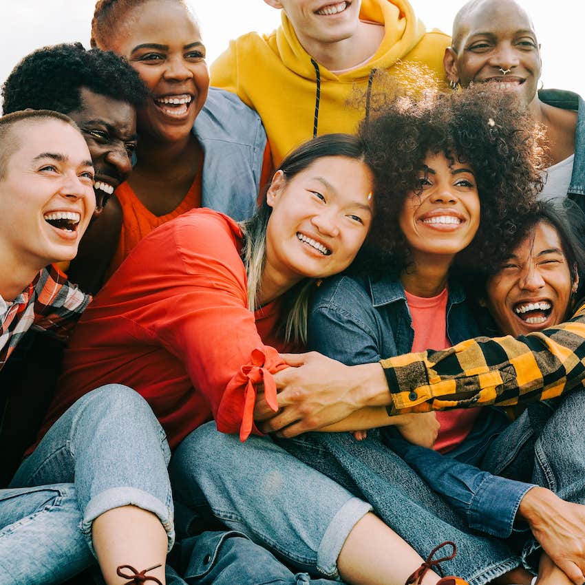 Group of close friends embrace