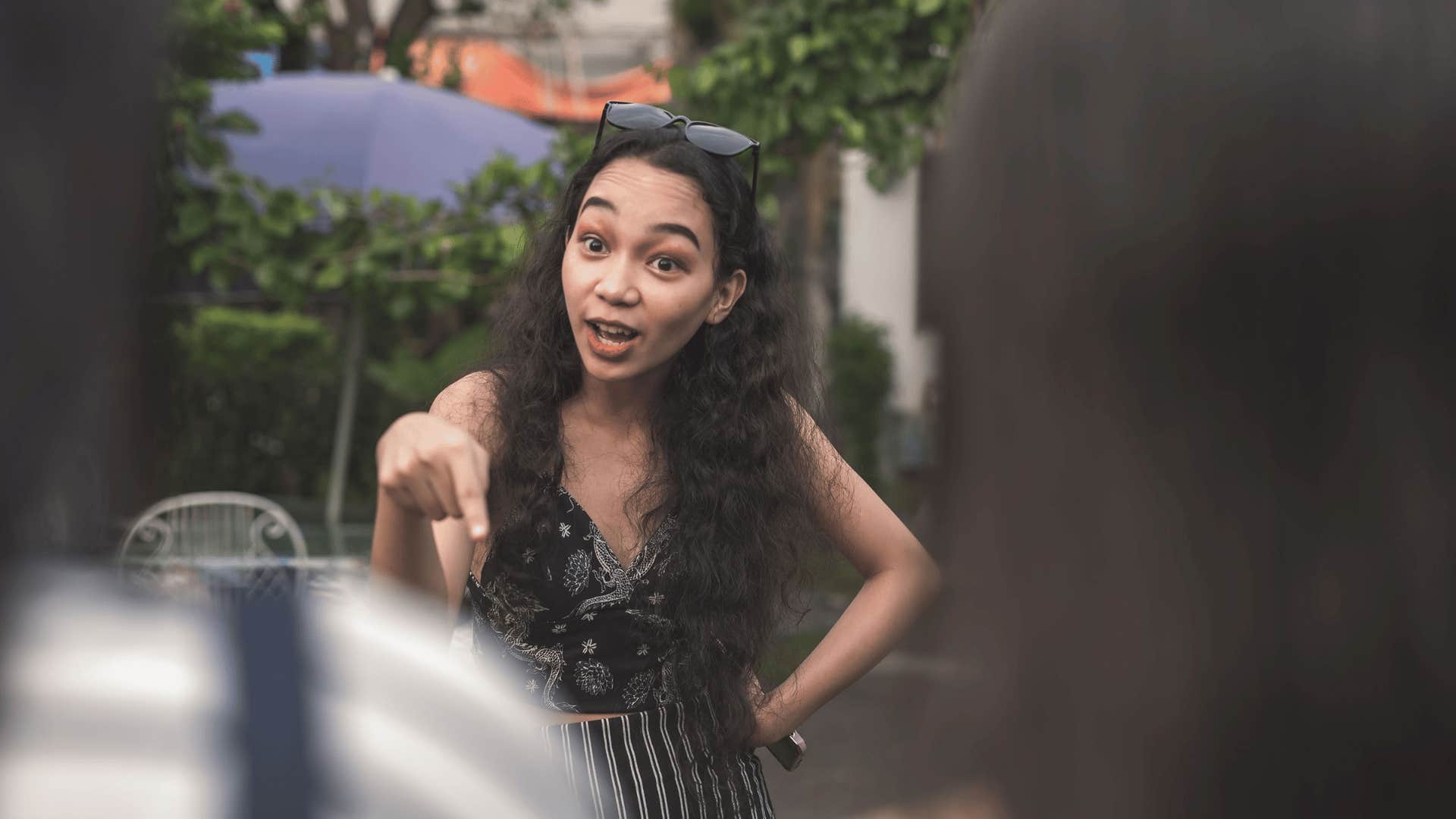 woman being entitled and yelling at two girls