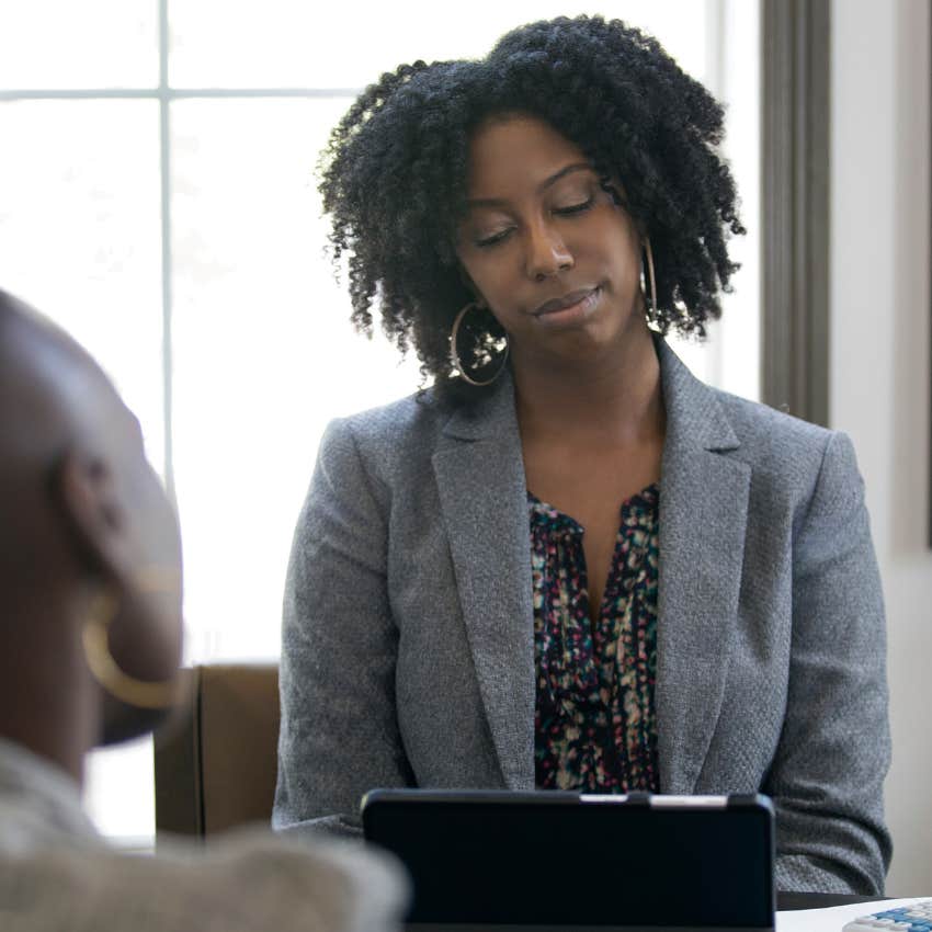 Envious manager looking disappointed in a work meeting. 