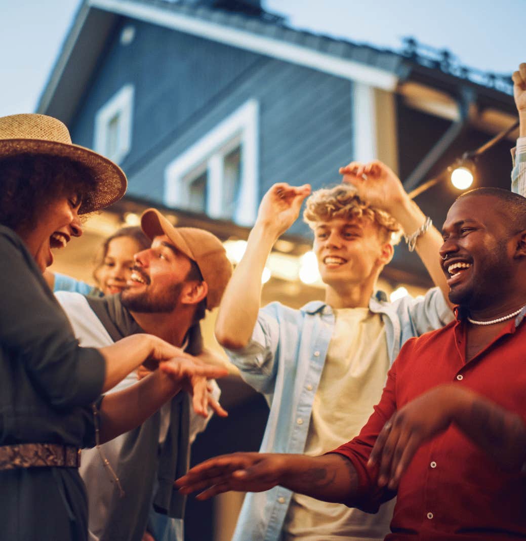 friends dancing in the backyard