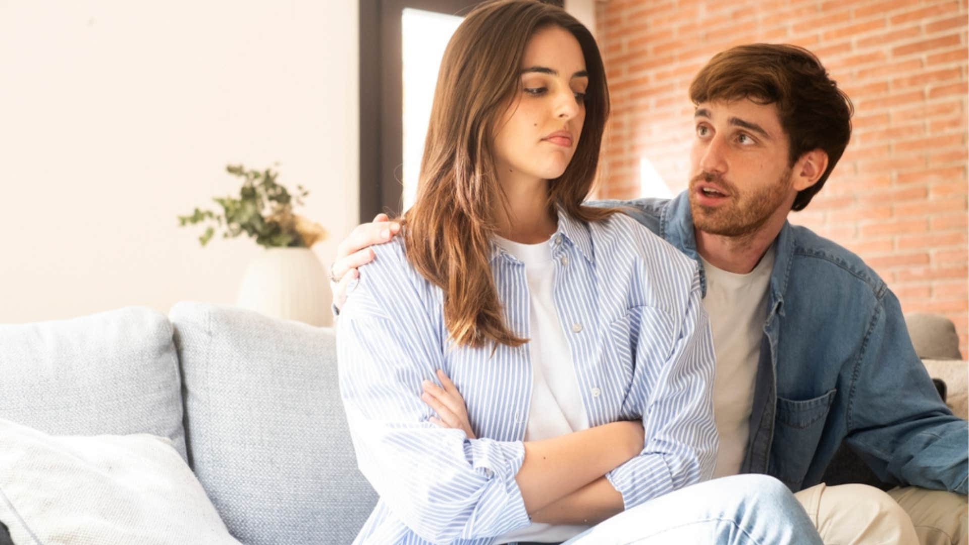 Woman looking frustrated with her boyfriend.