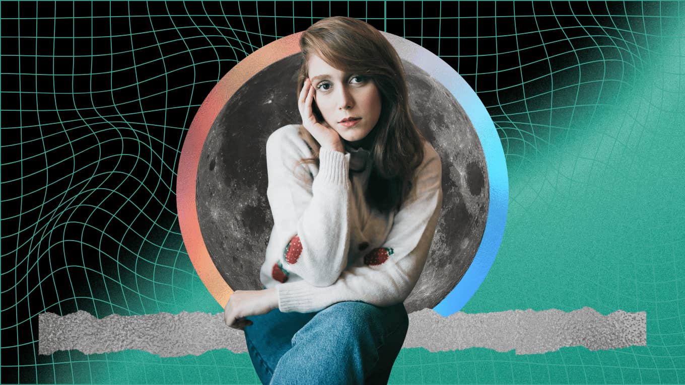 woman sitting in front of earth's second moon