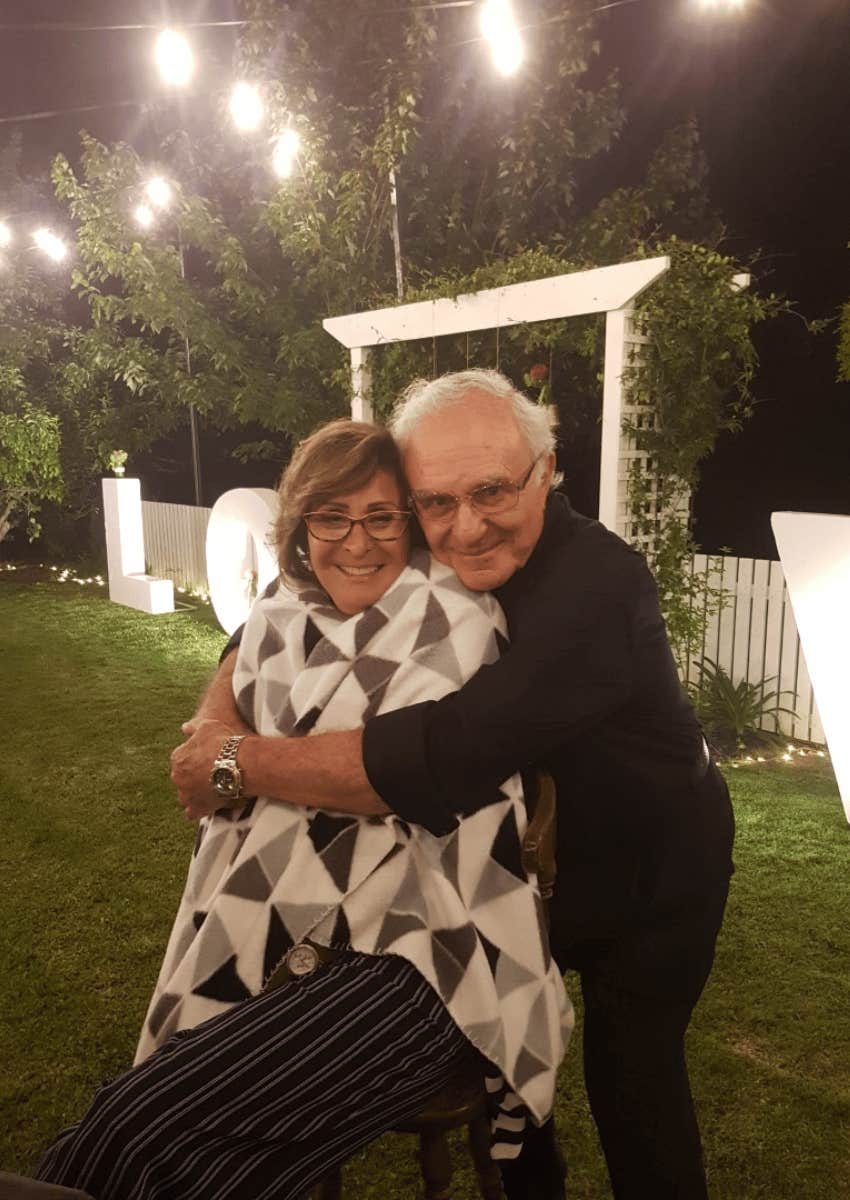 author posing with his wife