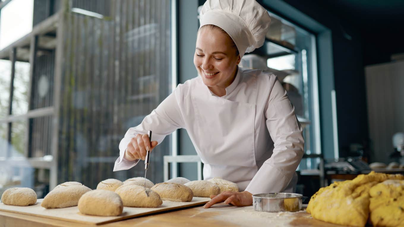 female baker making rolls