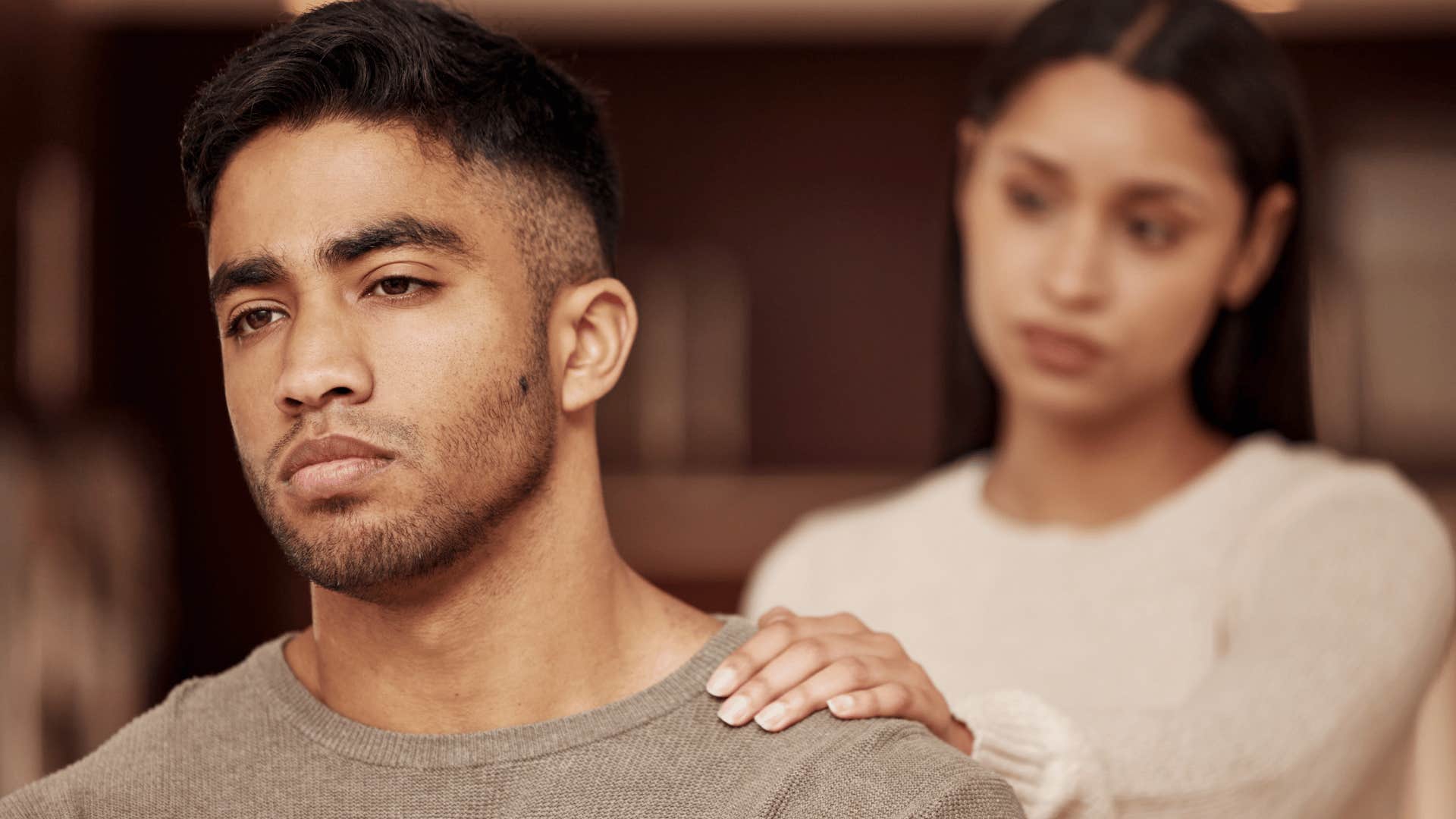 woman pleading with man while he's faced the other way