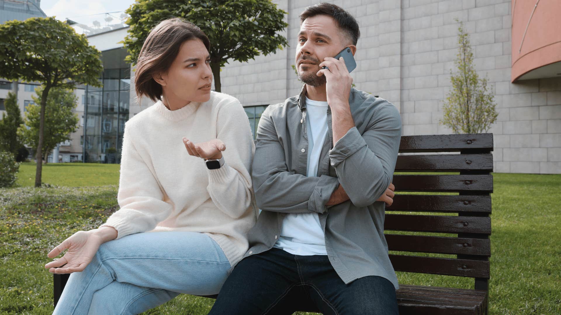 woman upset with man while he's on the phone