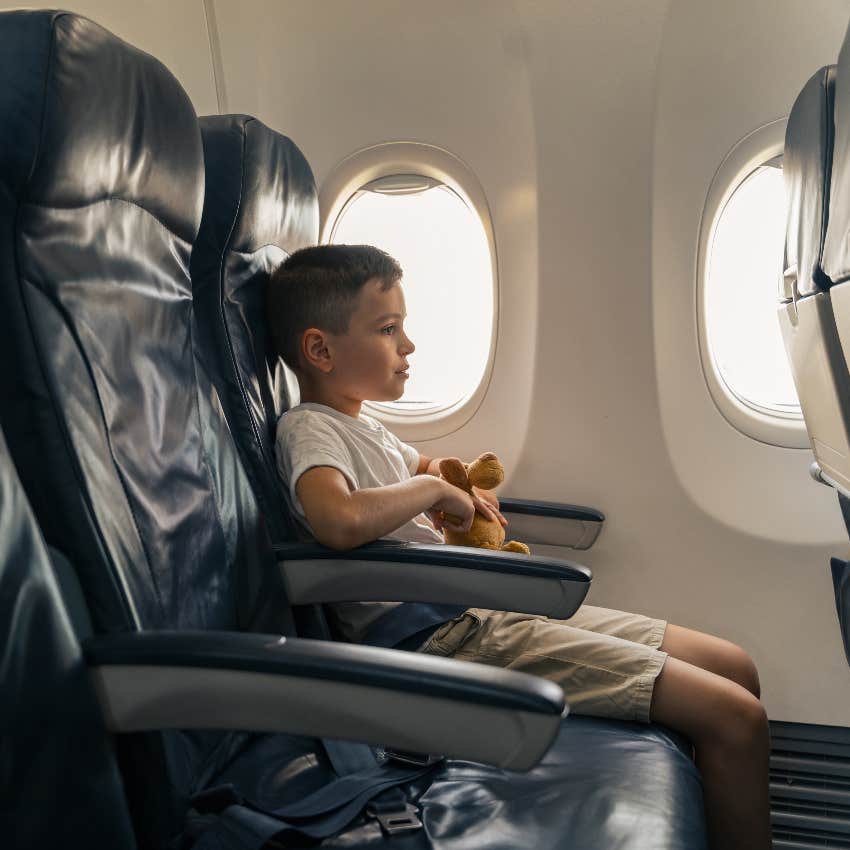 Boy sitting alone on a plane