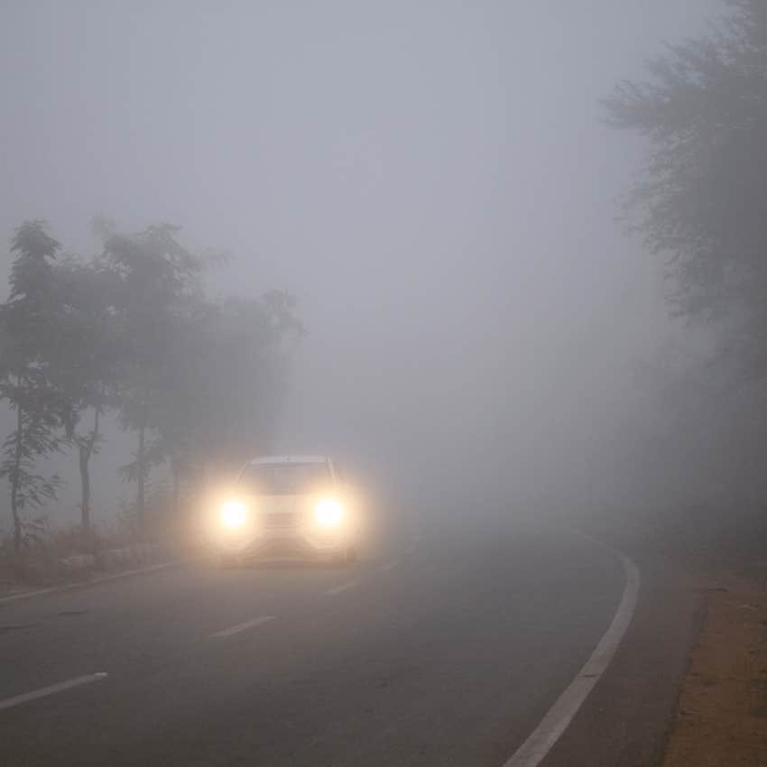 car driving in heavy fog