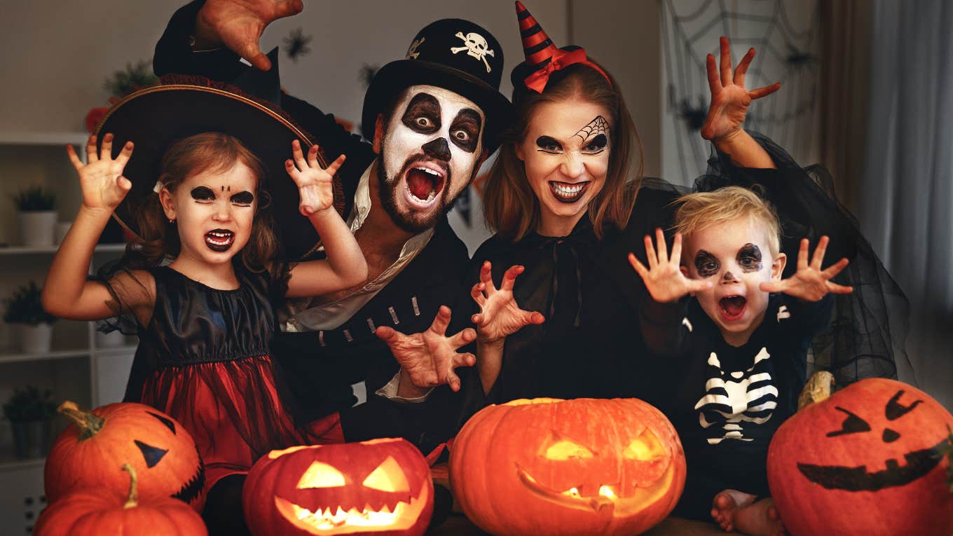 Parents and children dressed in Halloween costumes