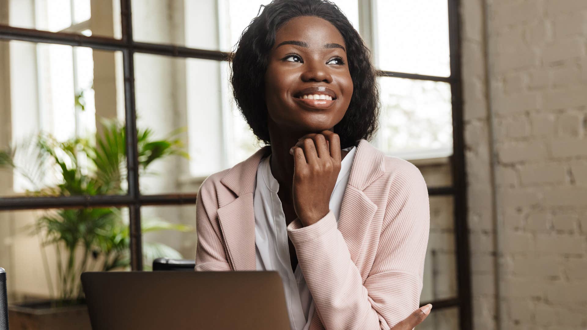 Confident woman sitting in her office.