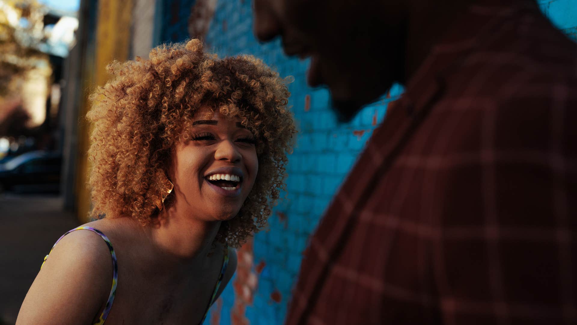 Woman looking happy while talking to a stranger