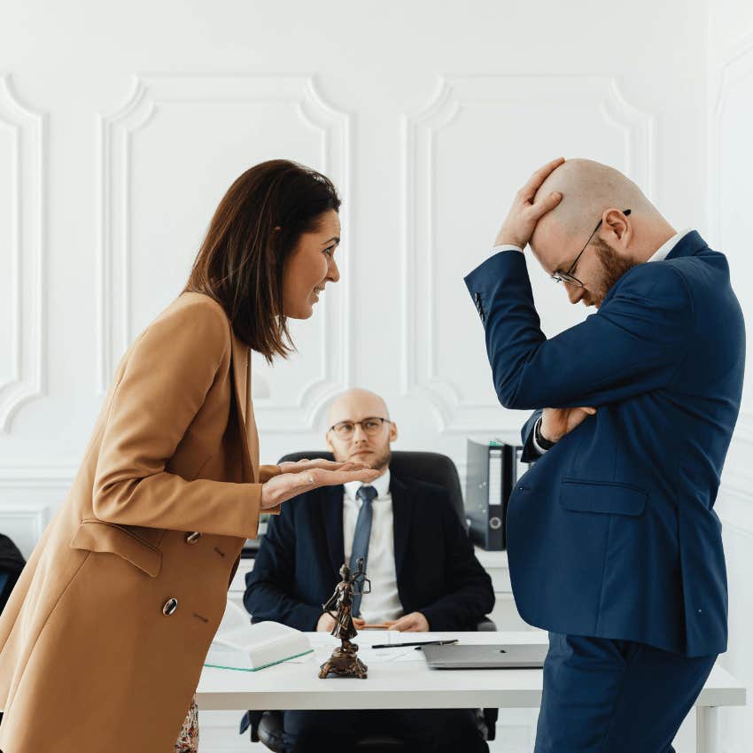 couple arguing in front of a divorce lawyer