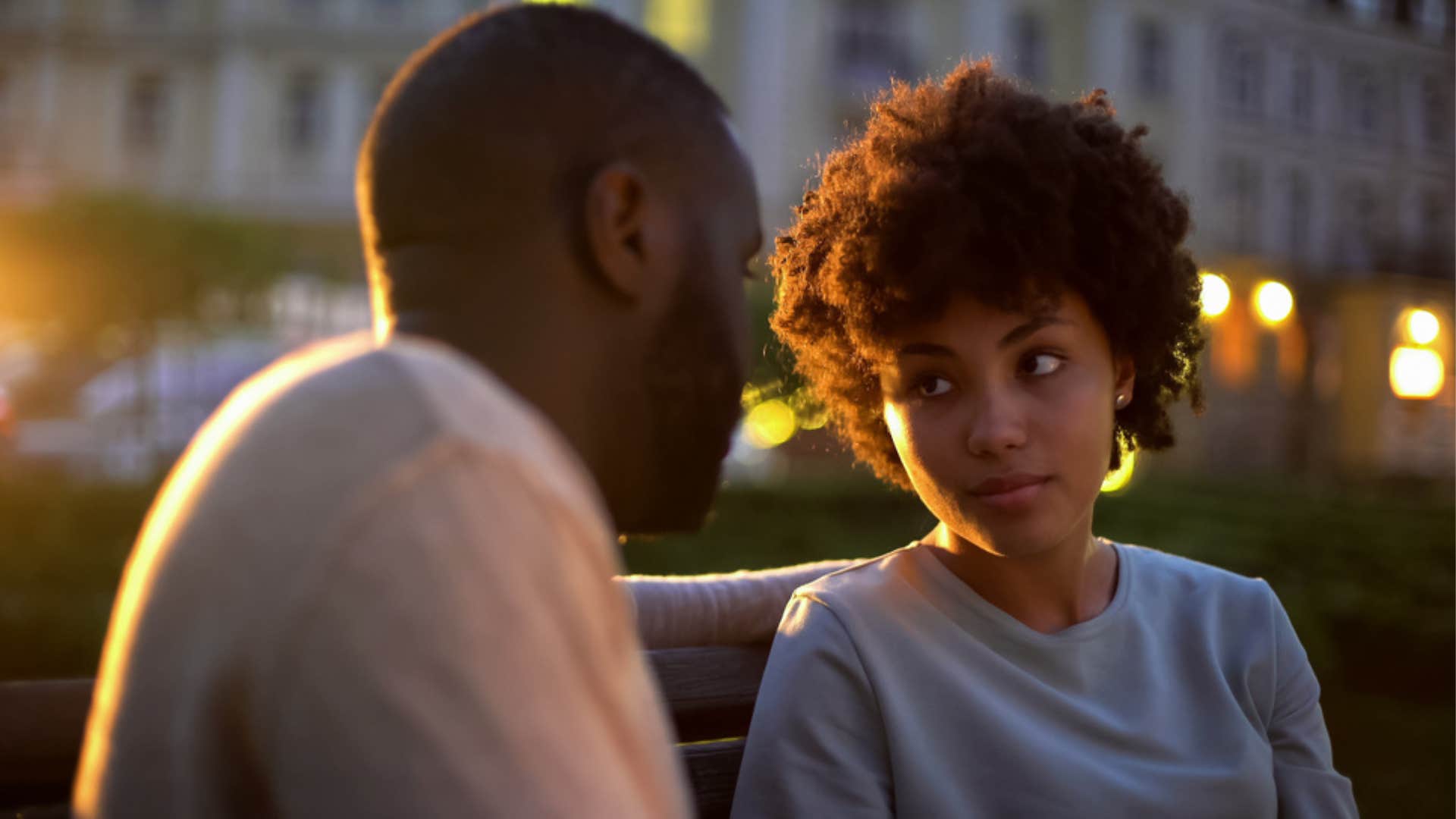 Woman looking frustrated talking with her partner.