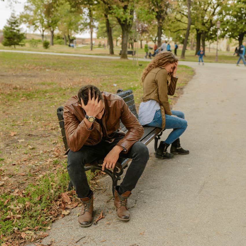 couple sitting on opposite ends of a bench