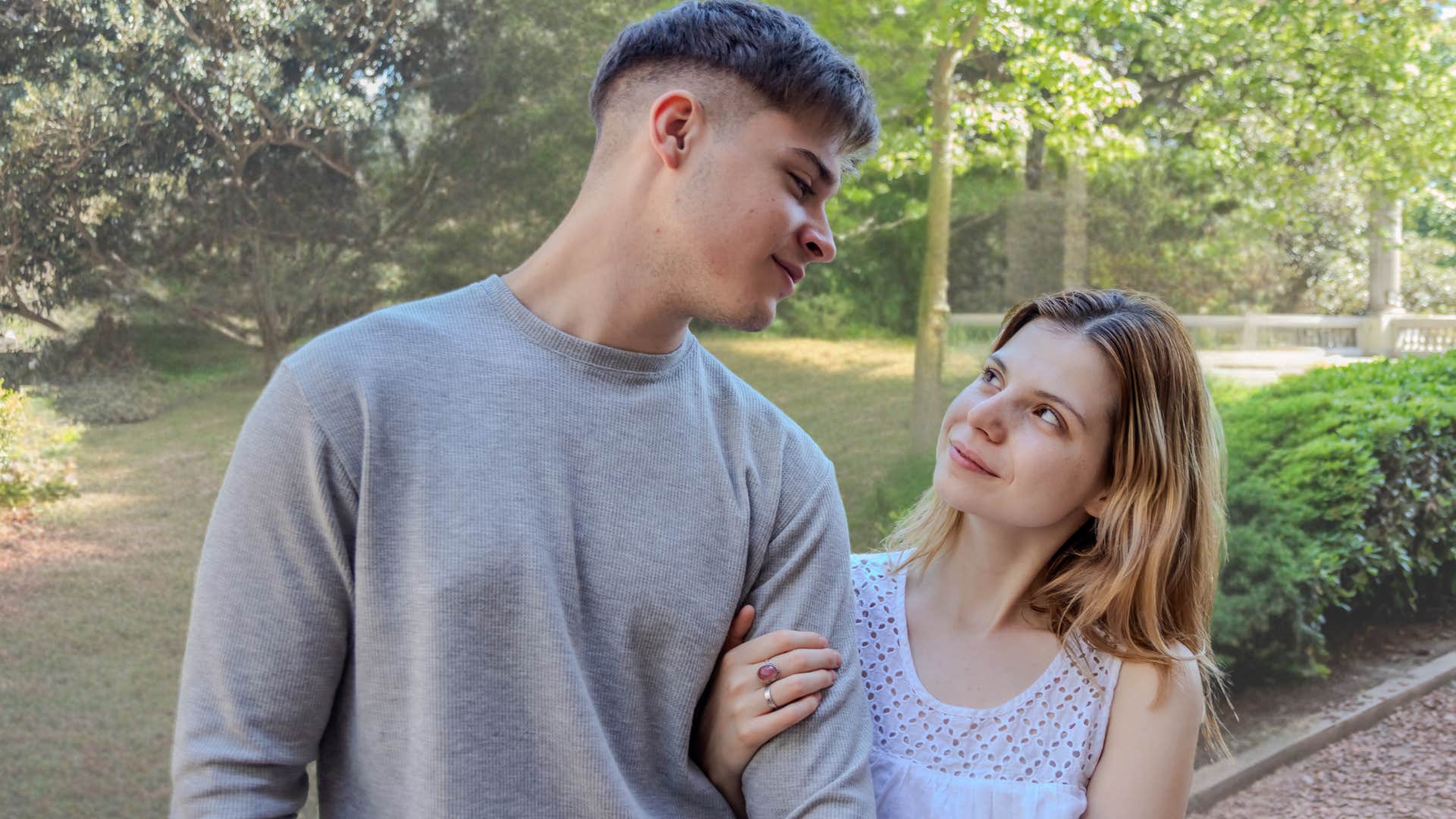 Couple smiling and walking together outside. 