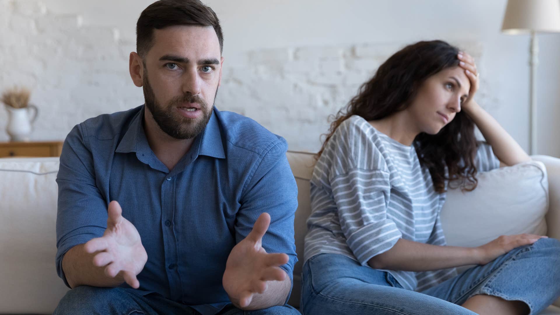 Woman looking annoyed while her partner talks. 