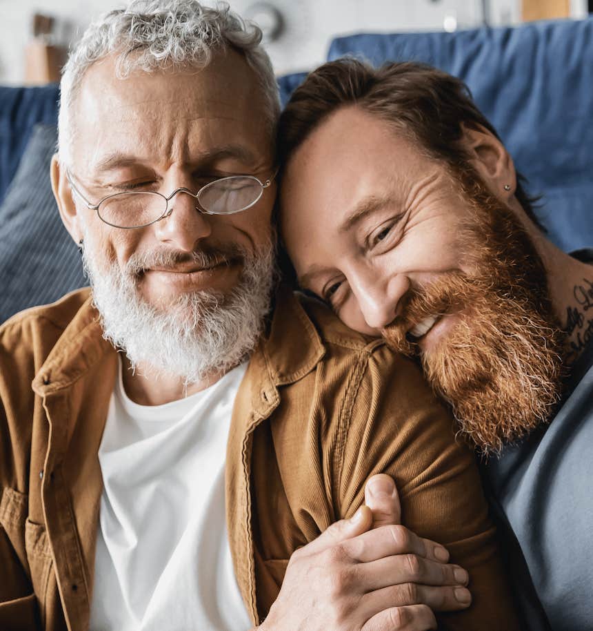 Close couple cuddles and smiles with comfort