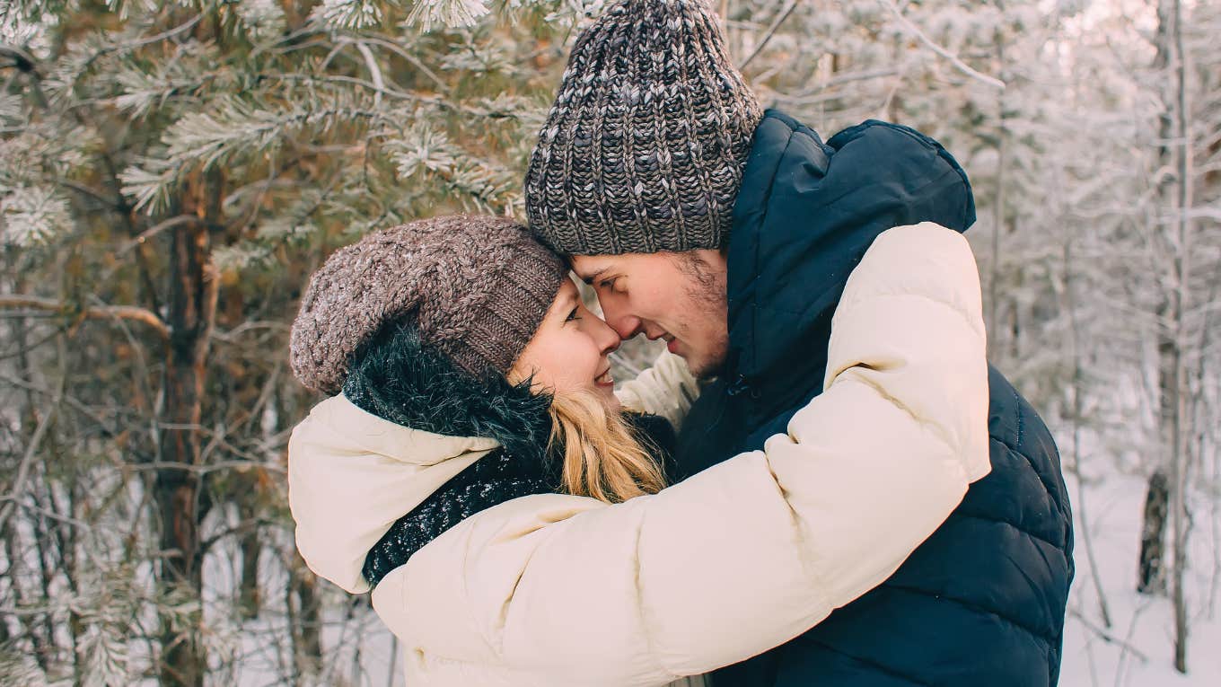 Partners get warm and cuddly in the cold weather.