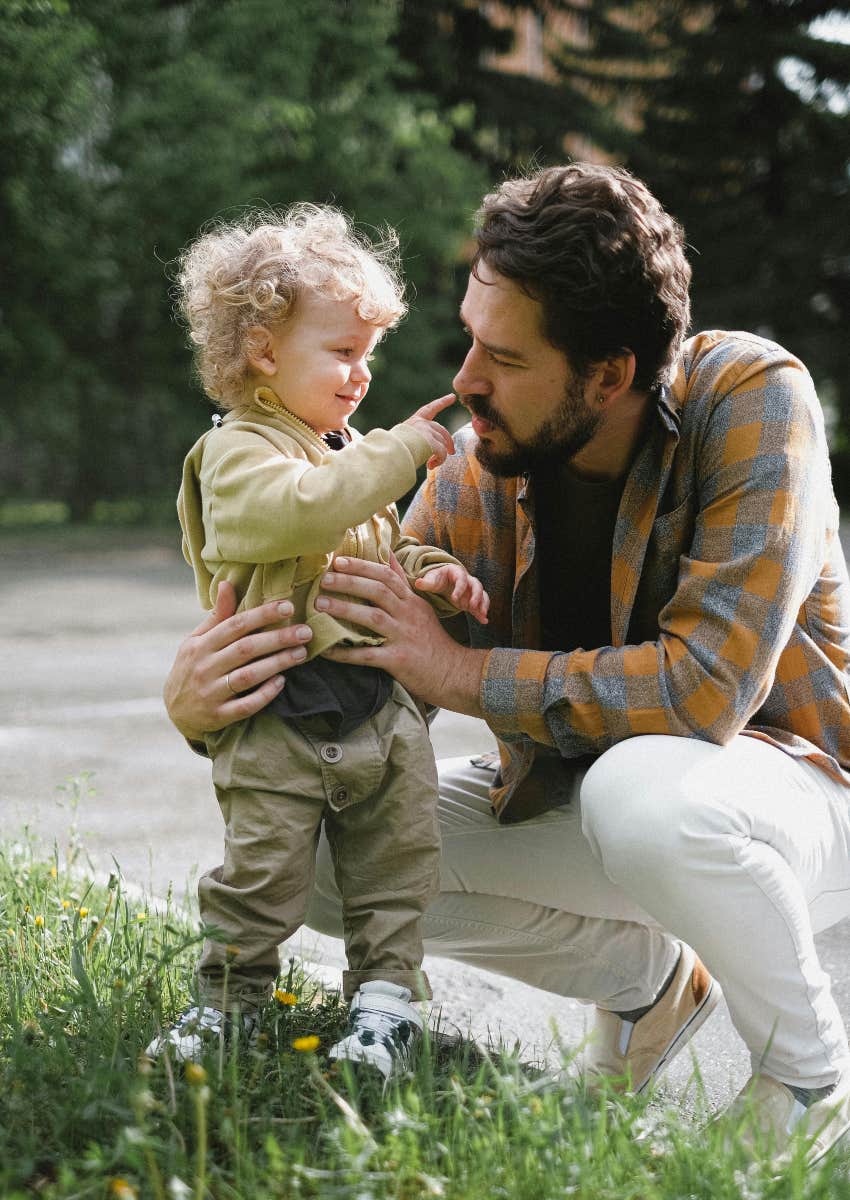 father and son playing outside