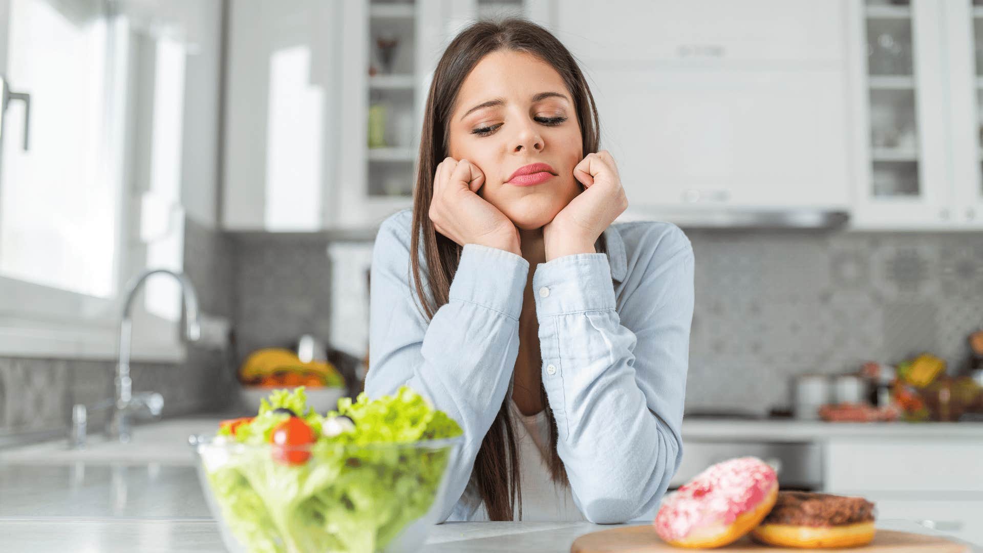 woman choosing between salad and donuts