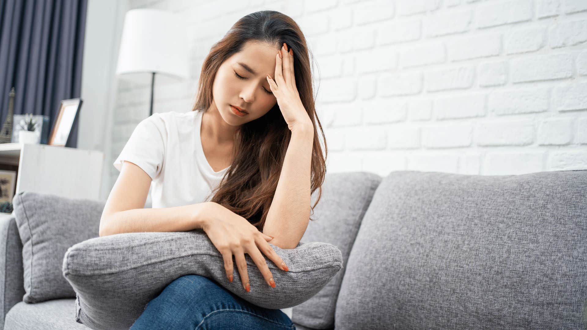 sad woman on couch