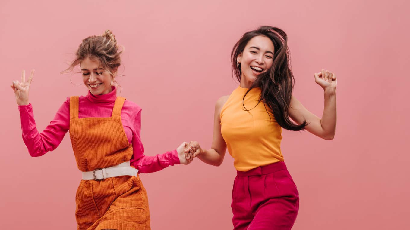 Two women dancing to help reduce their depression 