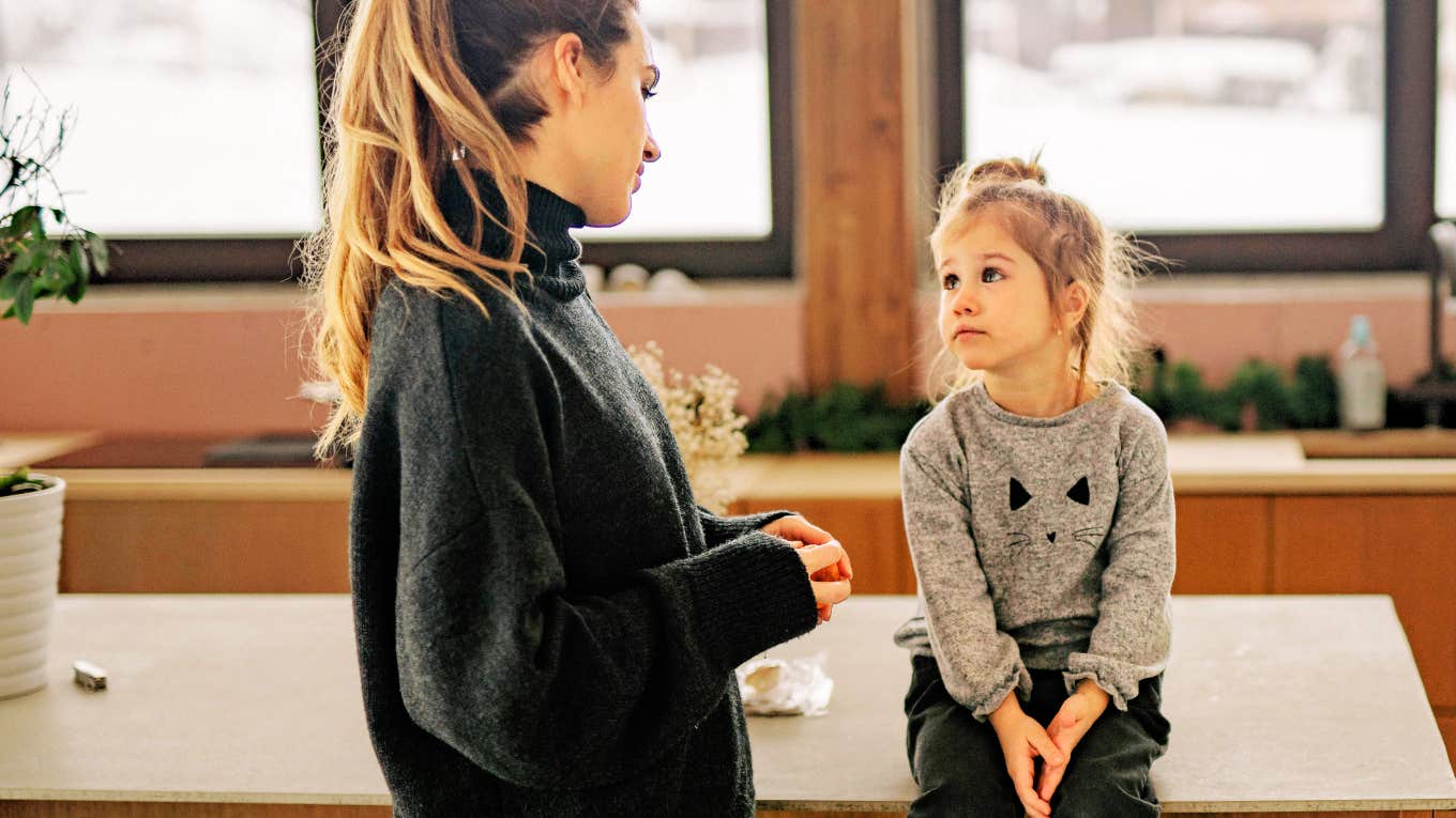 Parent talking to her daughter.