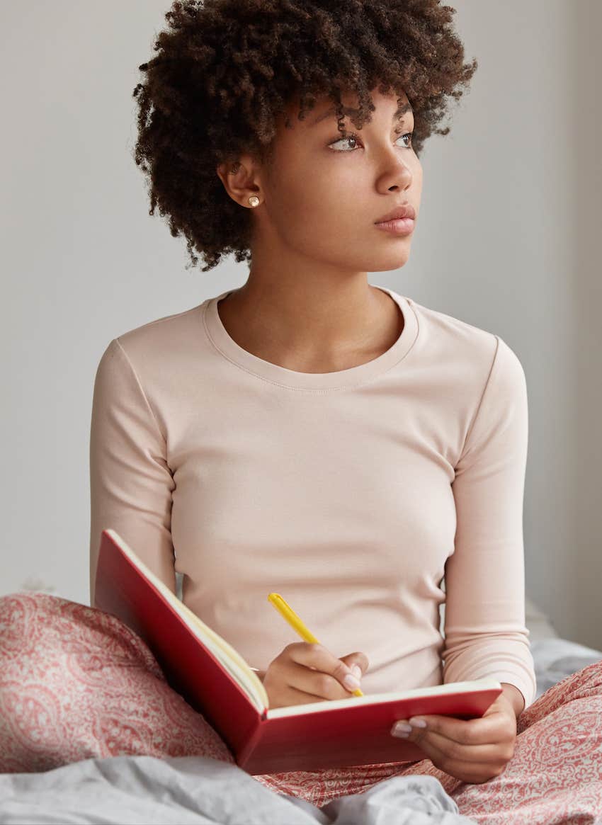 She look up and left from her book to ponder