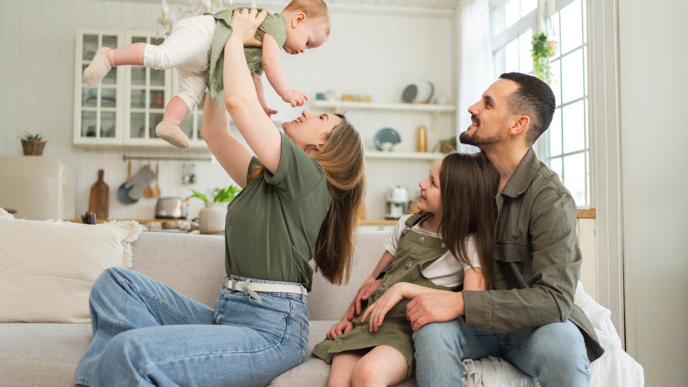 happy family sitting on a couch together