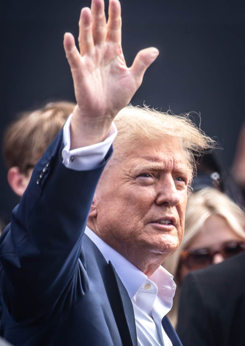 Donald Trump waving at racing event