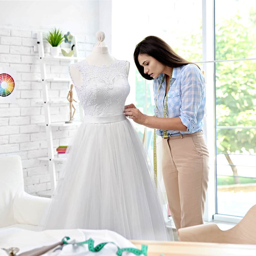 Dressmaker making wedding dress