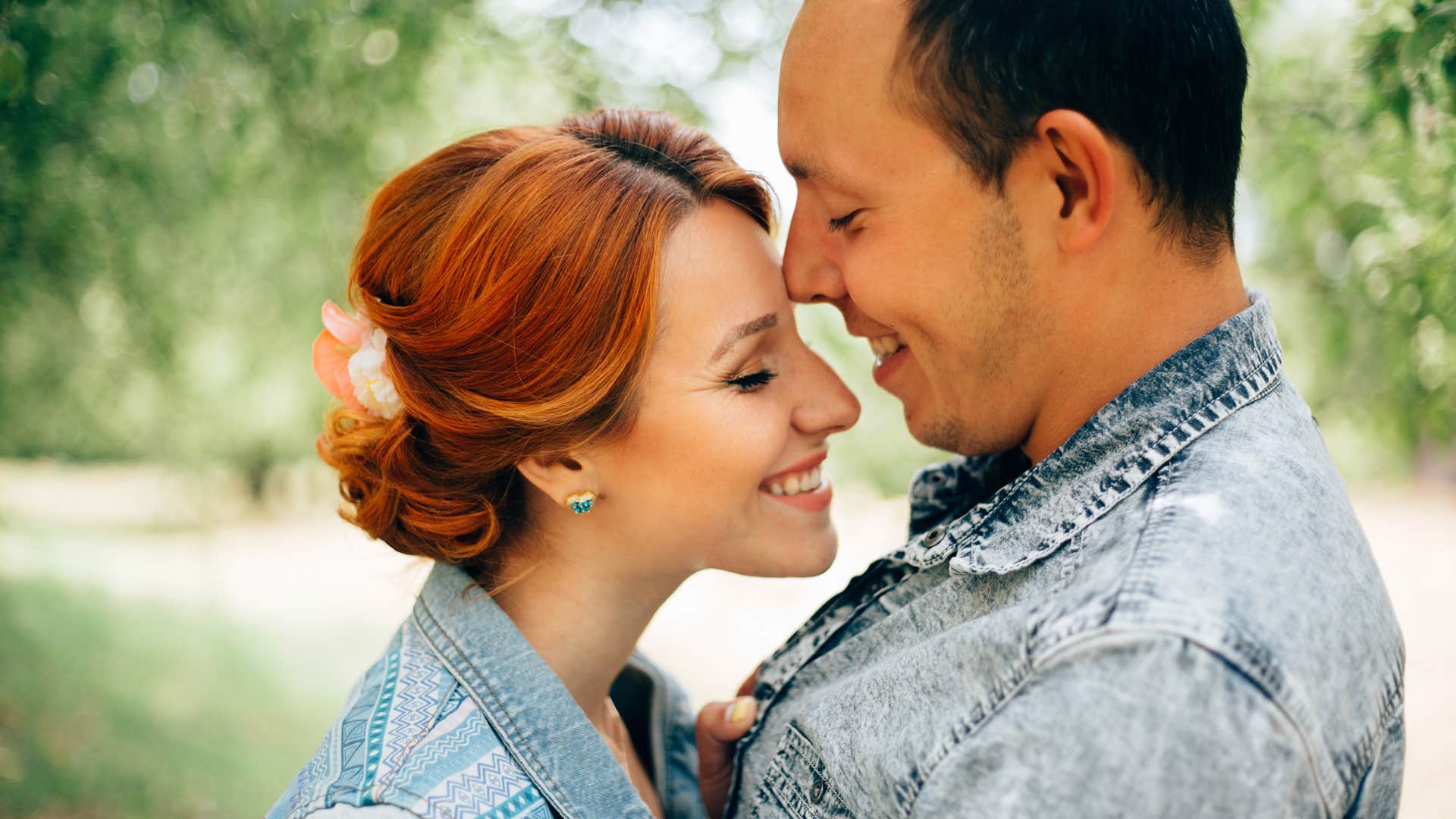 Woman hugging her husband and smiling. 