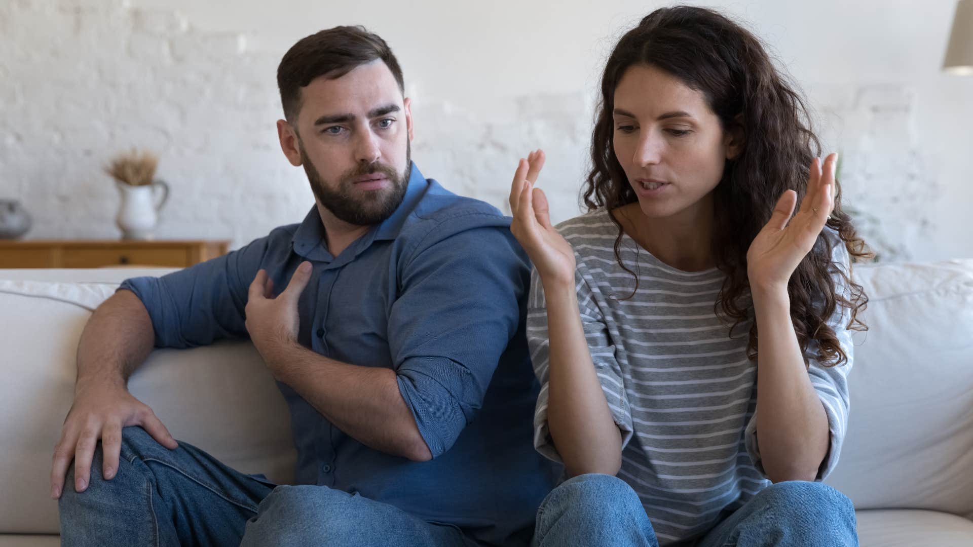 Man looking confused while his wife talks.