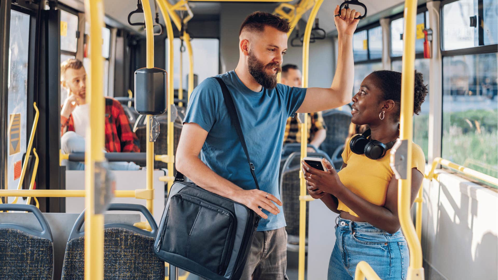 Couple ride public transit and chat