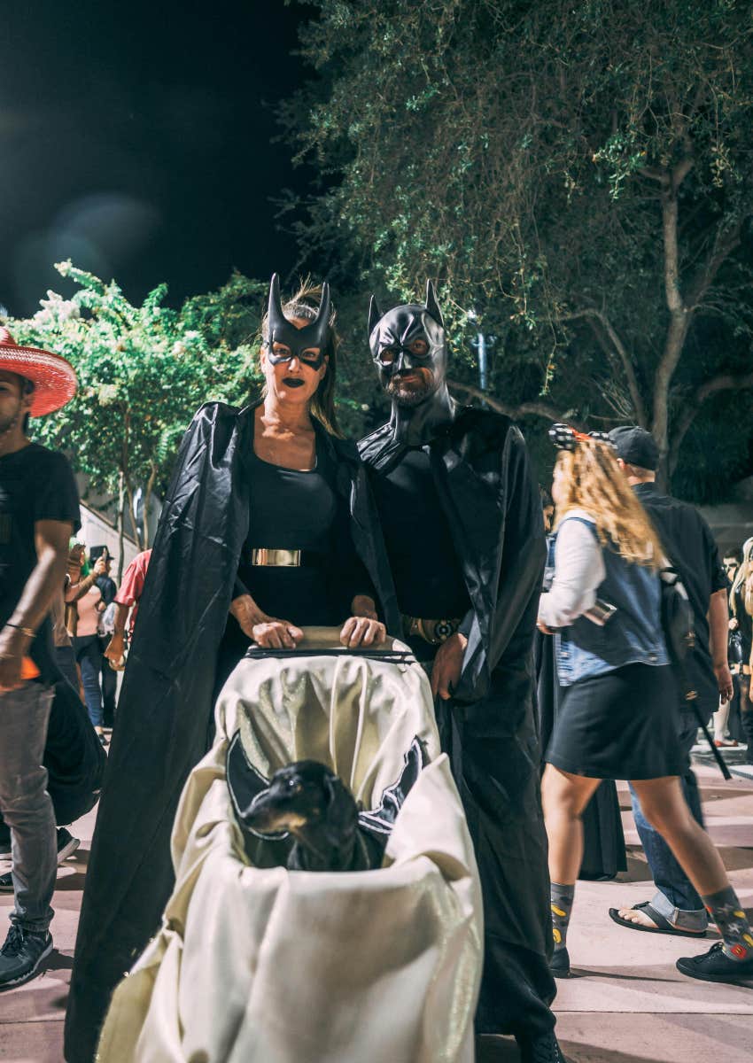 mom, dad and dog dressed up as Batman for Halloween