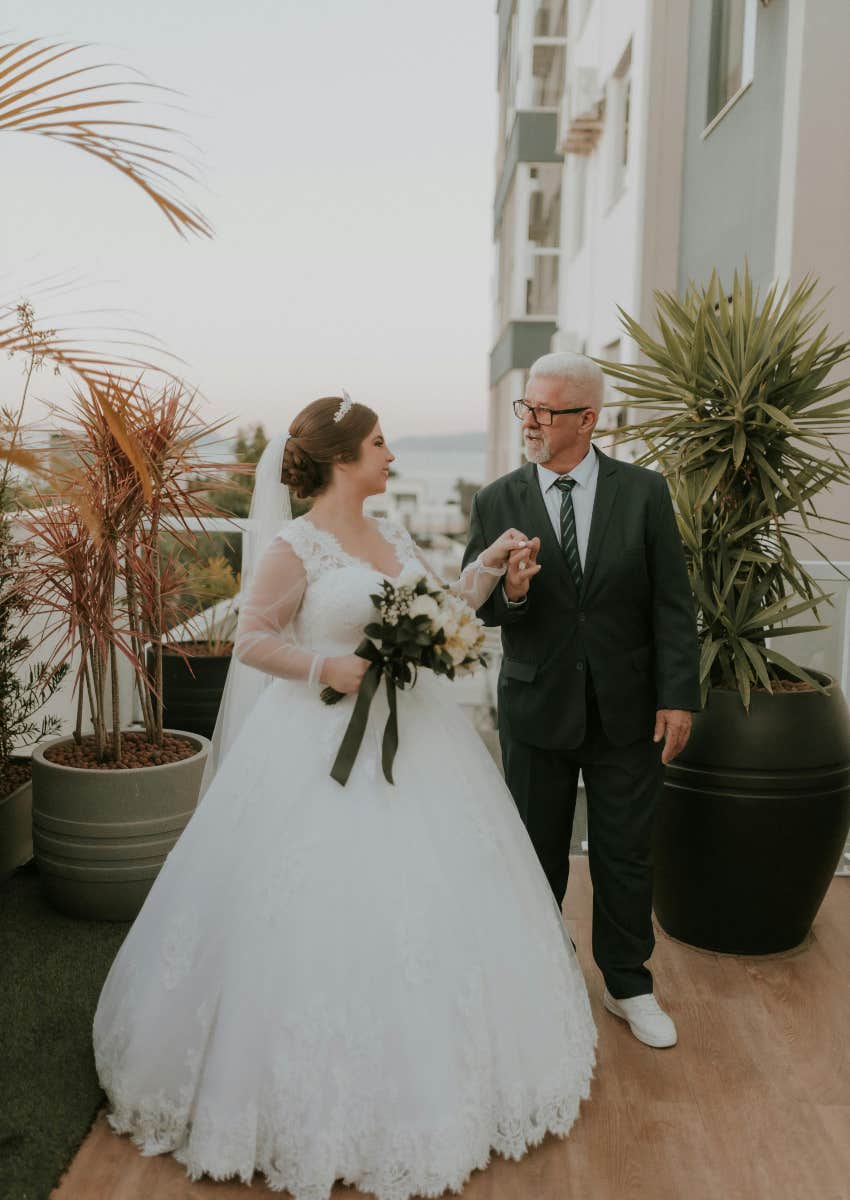 father of the bride and bride at wedding