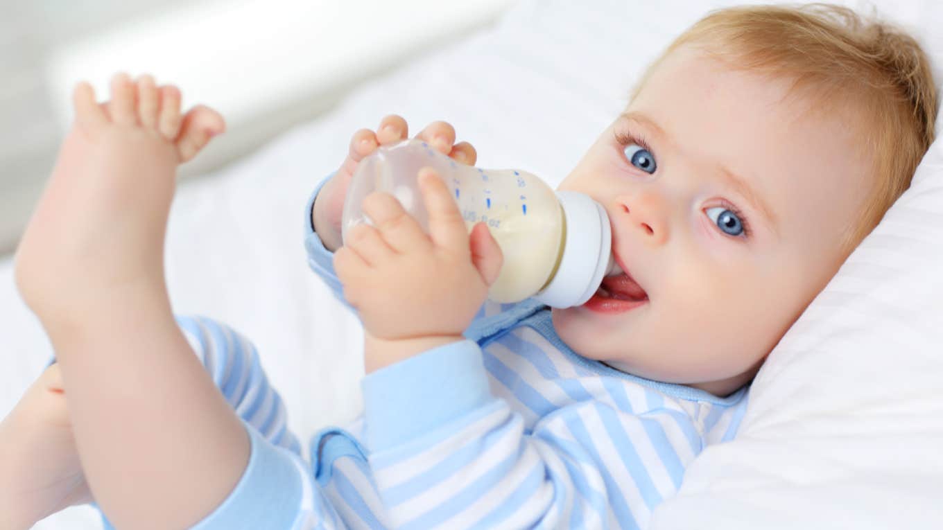 baby drinking from bottle 